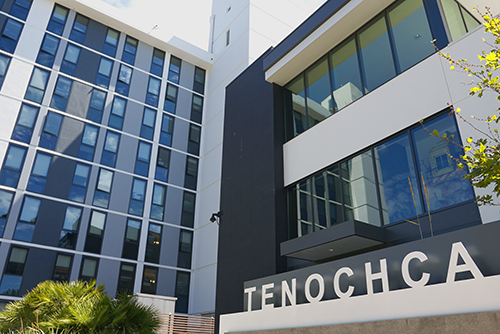 Black, white and grey building facade at upward angle