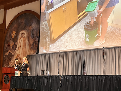 Student Assistants speaking on stage at the Second Annual Sustainability Summit